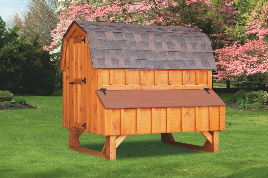 dutch chicken coop with reddish shingle roof side egg collection box slightly raised off of the ground