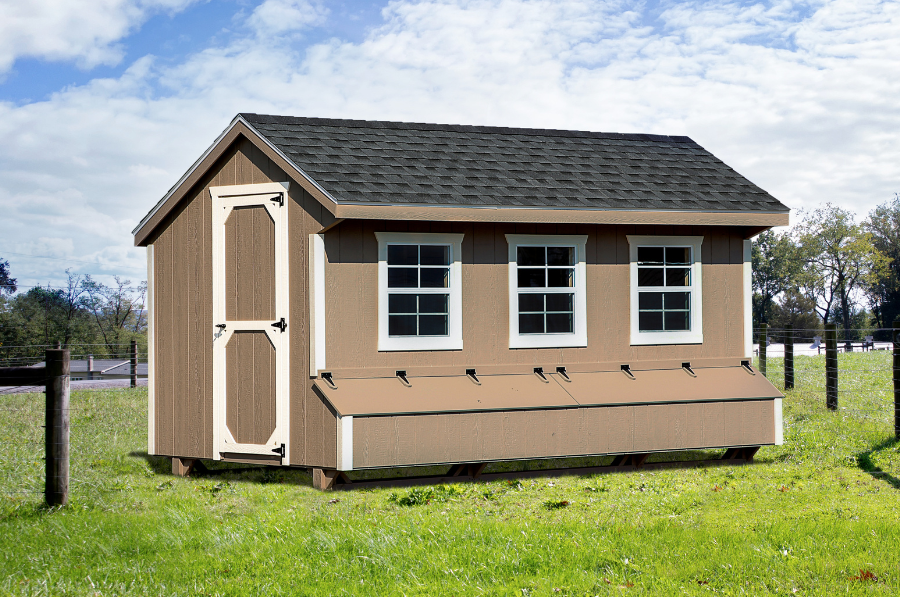 brown quaker chicken coop with white trim and shingle roof