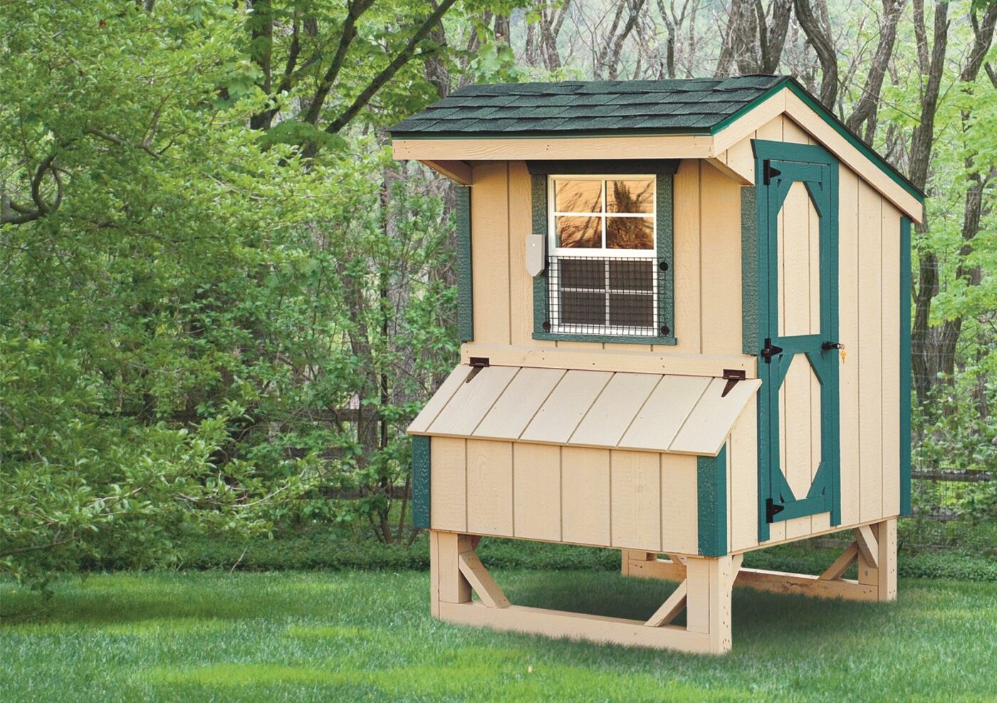 light wooden quaker chicken coops in Kansas with green trim