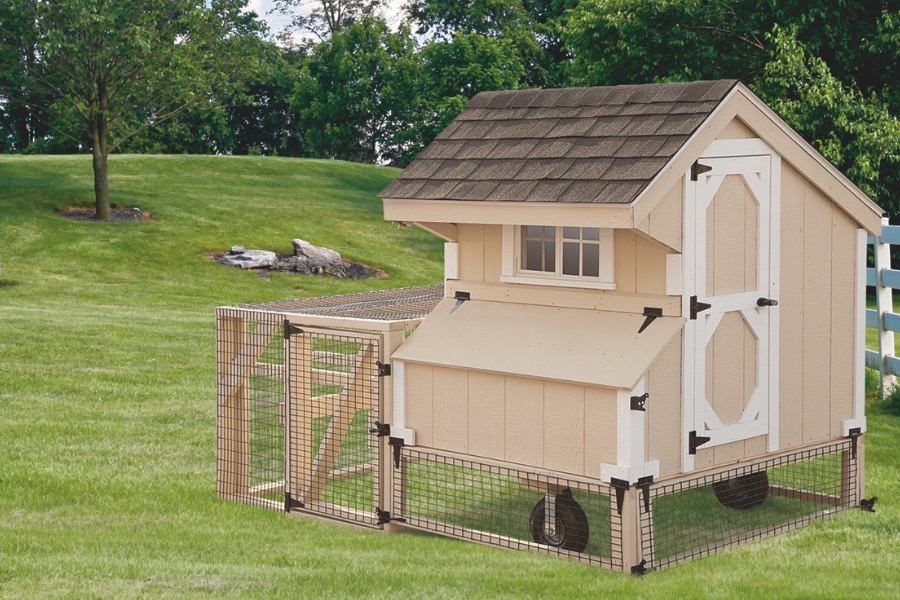 tan and white trimmed tractor chicken coop with attached run and wheels (1)