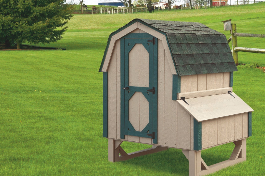 tan dutch chicken coops for sale in Bowling Green KY with green trim and curved shingle roof
