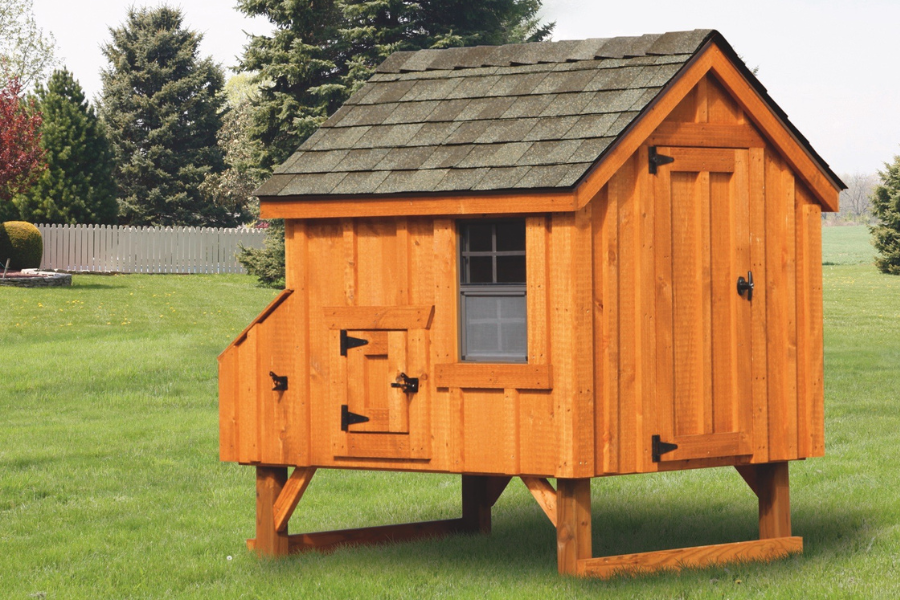 wooden a frame chicken coop with shingle roof