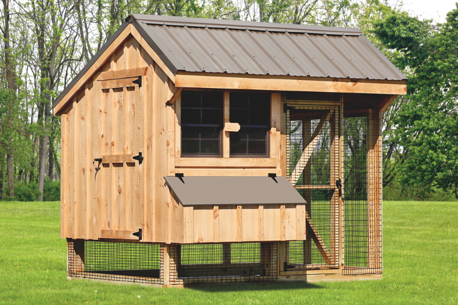 light colored wooden combination chicken coop with brown metal roof attached run and brown lid on egg collection box
