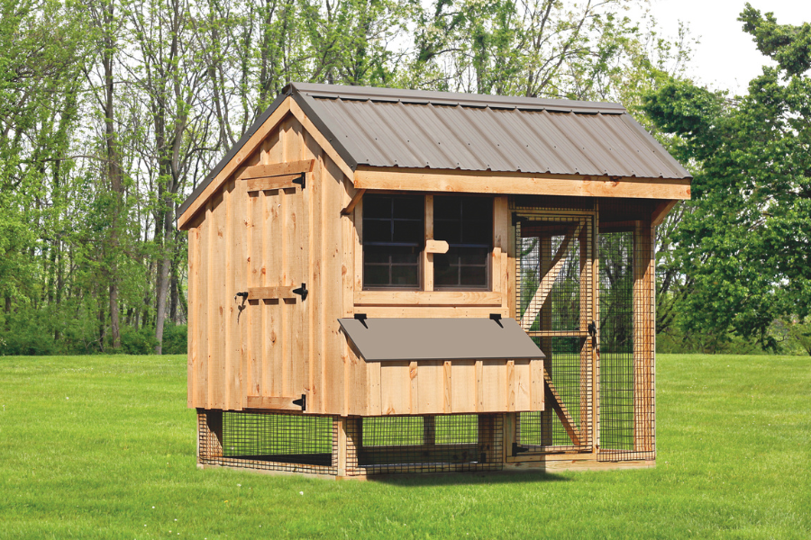 light wooden combination chicken coop with brown metal roof and an attached run