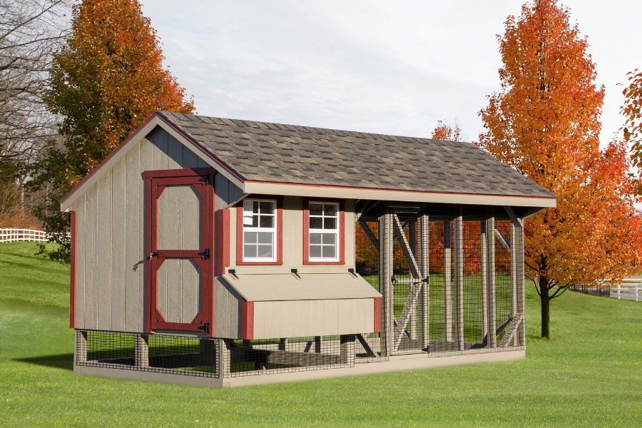 tan combination chicken coops for sale in Albuquerque NM with red trim two windows shingle roof egg collection box and an attached run