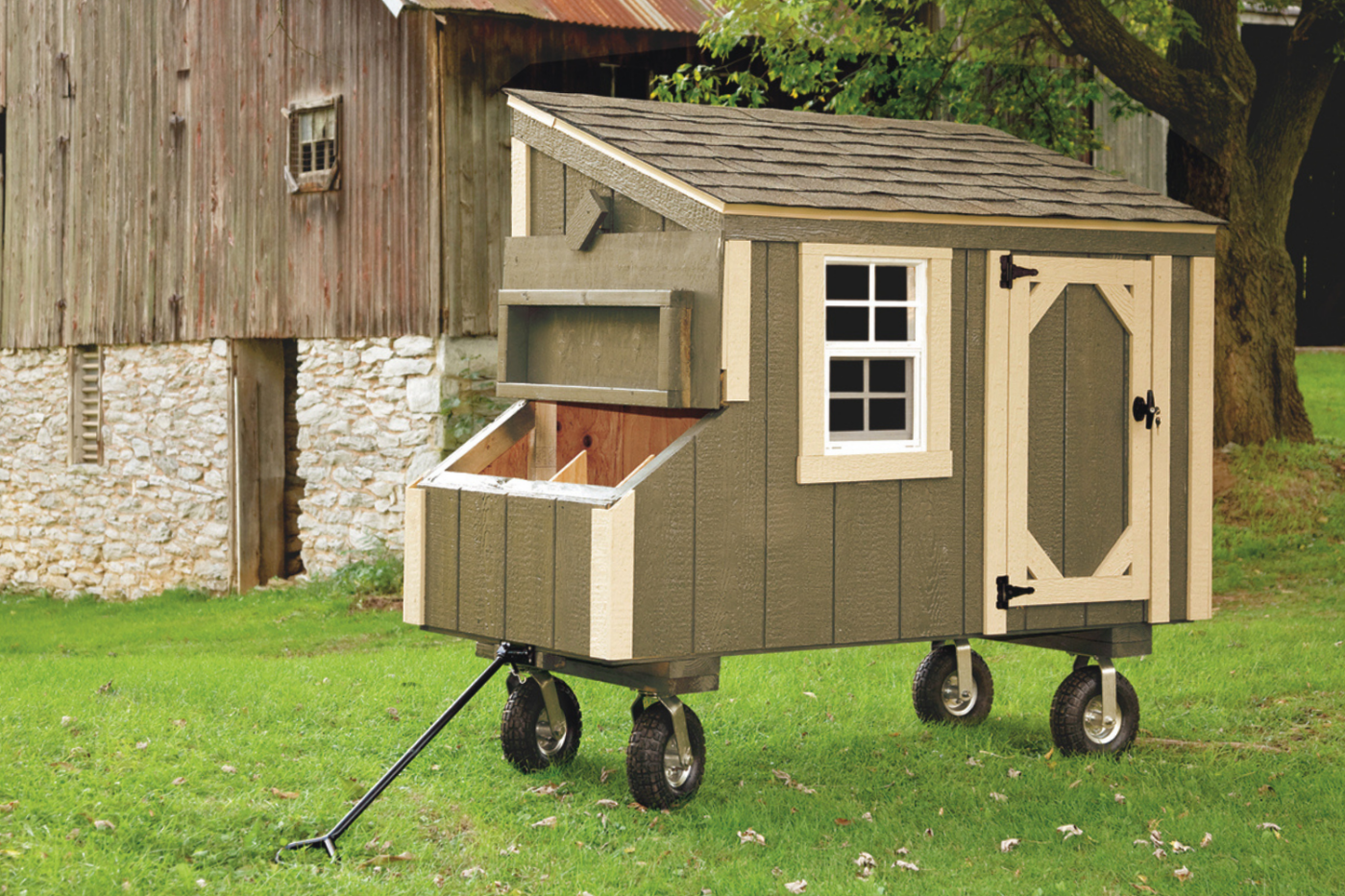 green and beige lean to chicken coop with windows and wheels in portland or