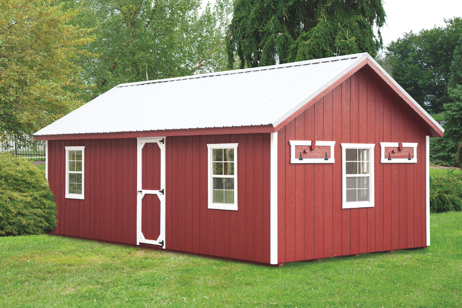 red a frame chicken coop with white trim and white metal roof