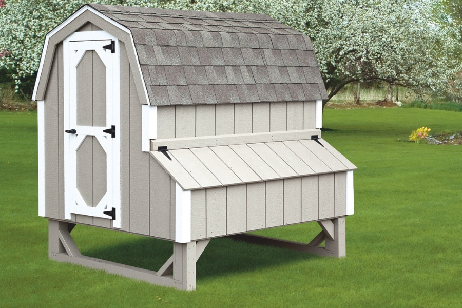 gray curved barn style roof chicken coop with white trim