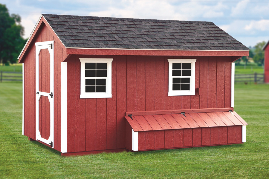 red quaker chicken coop with white trim shingle roof egg collection box and side door