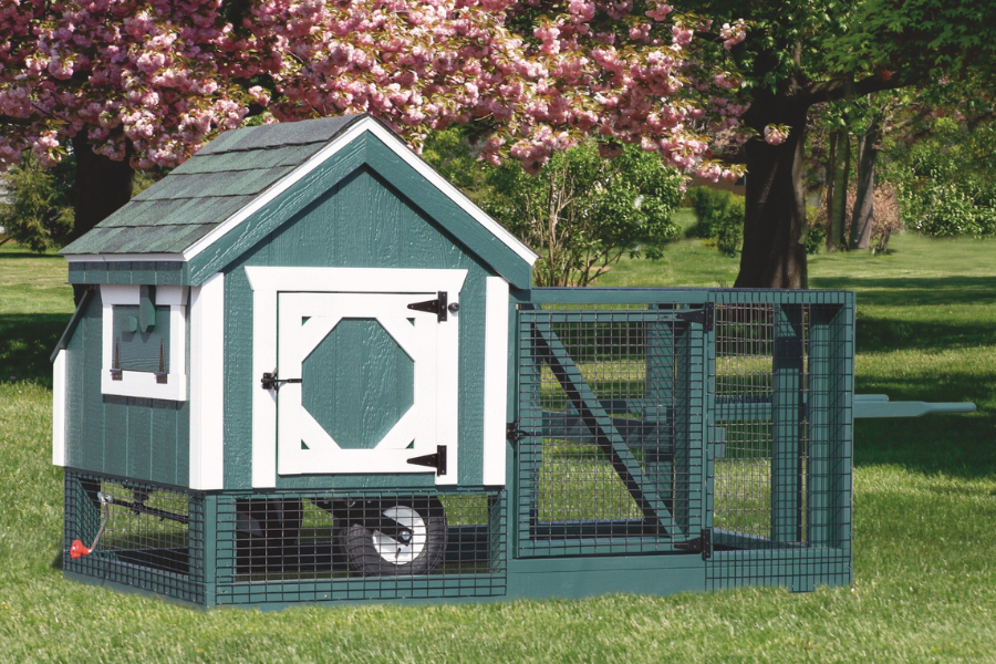 green tractor chicken coops for sale in San Antonio TX with white trim wheels and an attached run
