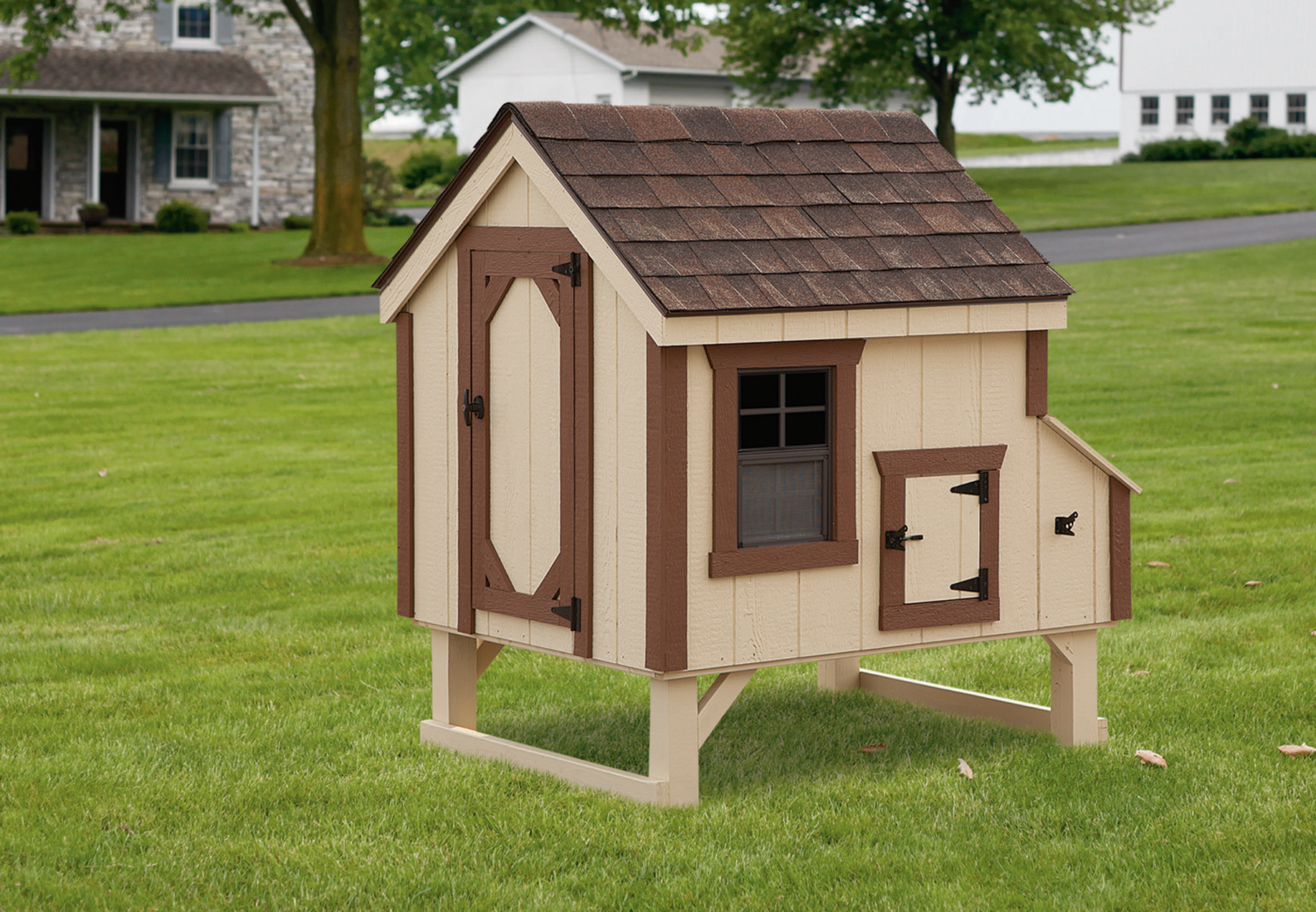 A tan A-Frame chicken coop with brown trim and brown shingles available for West Valley City residents.