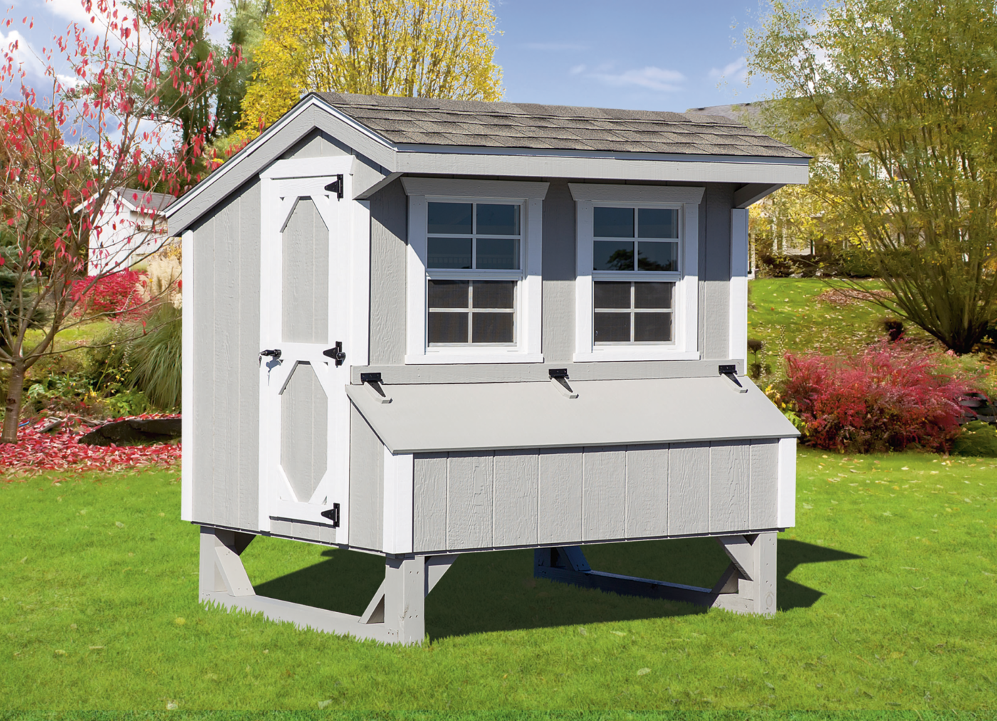 A gray siding quaker chicken coop with white trim available to residents in West Valley City, UT.