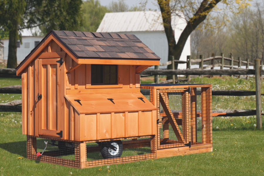 wooden tractor chicken coop with wheels and attached run