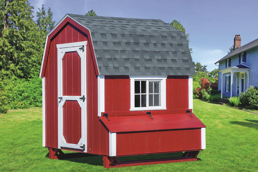 red and white trimmed dutch chicken coop with curved shingle roof
