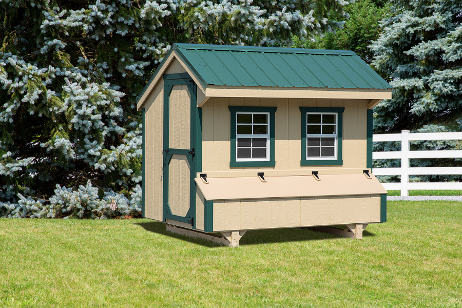 tan quaker chicken coops for sale in Charleston WV with green trim and dark green metal roof