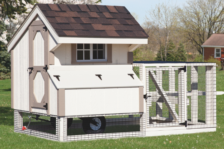 white tractor chicken coops with tan trim wheels and attached run