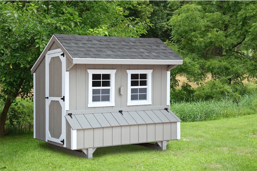 tanish gray and white trimmed quaker coop with gray shingle roof and two white trimmed windows on the front