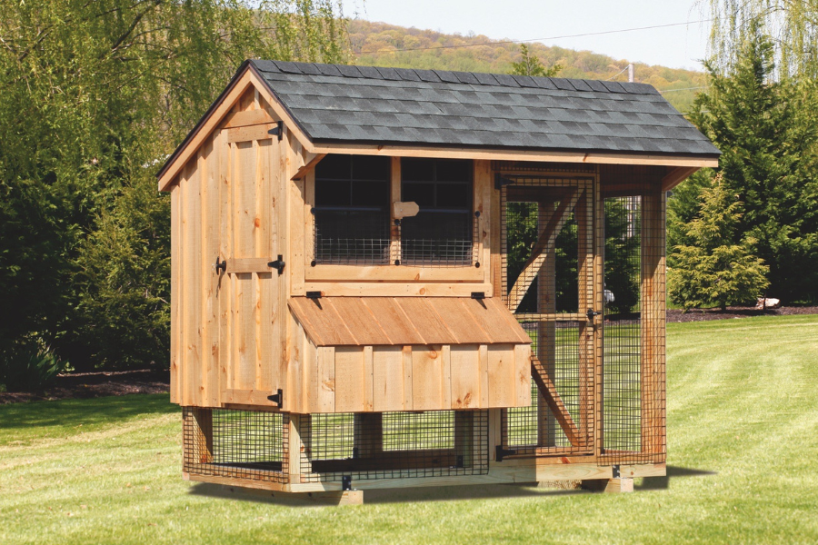 chicken coop made of light colored wood featuring two windows a gray shingle roof and an attached run