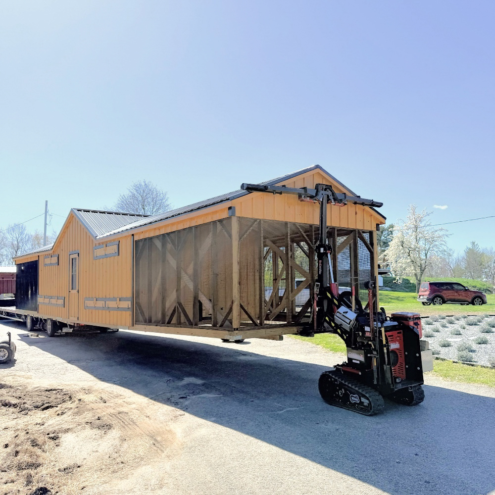 Shed mule placing long 12x50 A Frame Double Combination Coop in Jefferson MA 1788