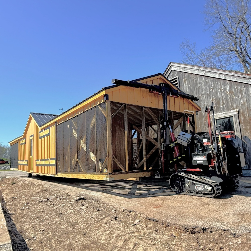 Shed mule moving 12x50 A Frame Double Combination Coop in Jefferson MA 1790