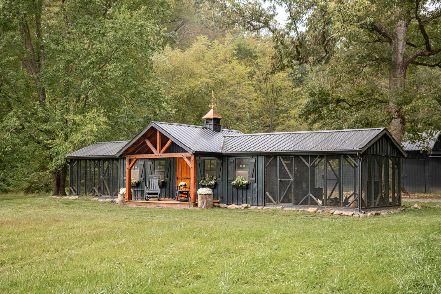 black 12x50 custom combination chicken coop with timber frame gable porch and cupola