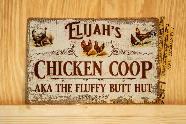 custom sign inside wooden chicken coop