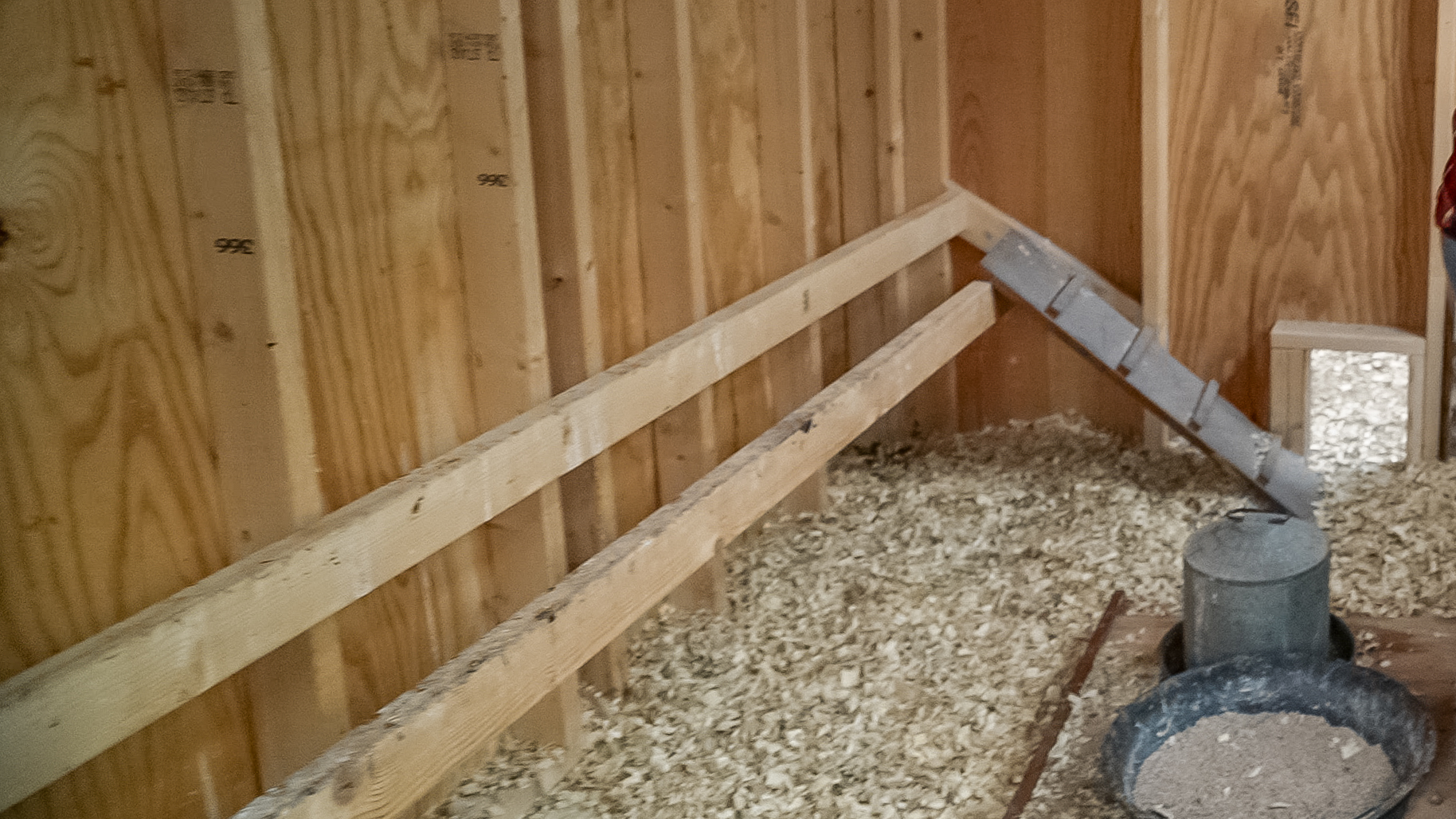 roosting bars along the wall of the 7x28 Chicken Coop