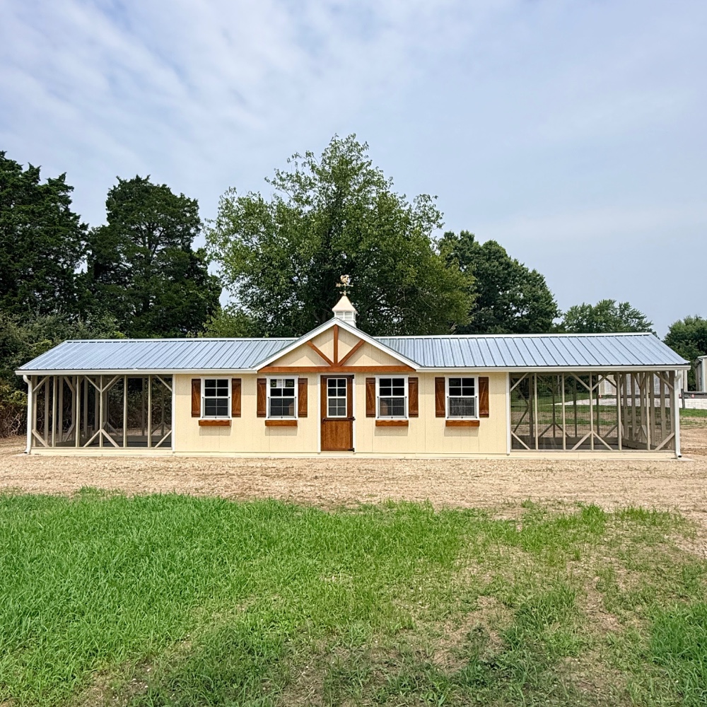 tan custom chicken coop with double runs