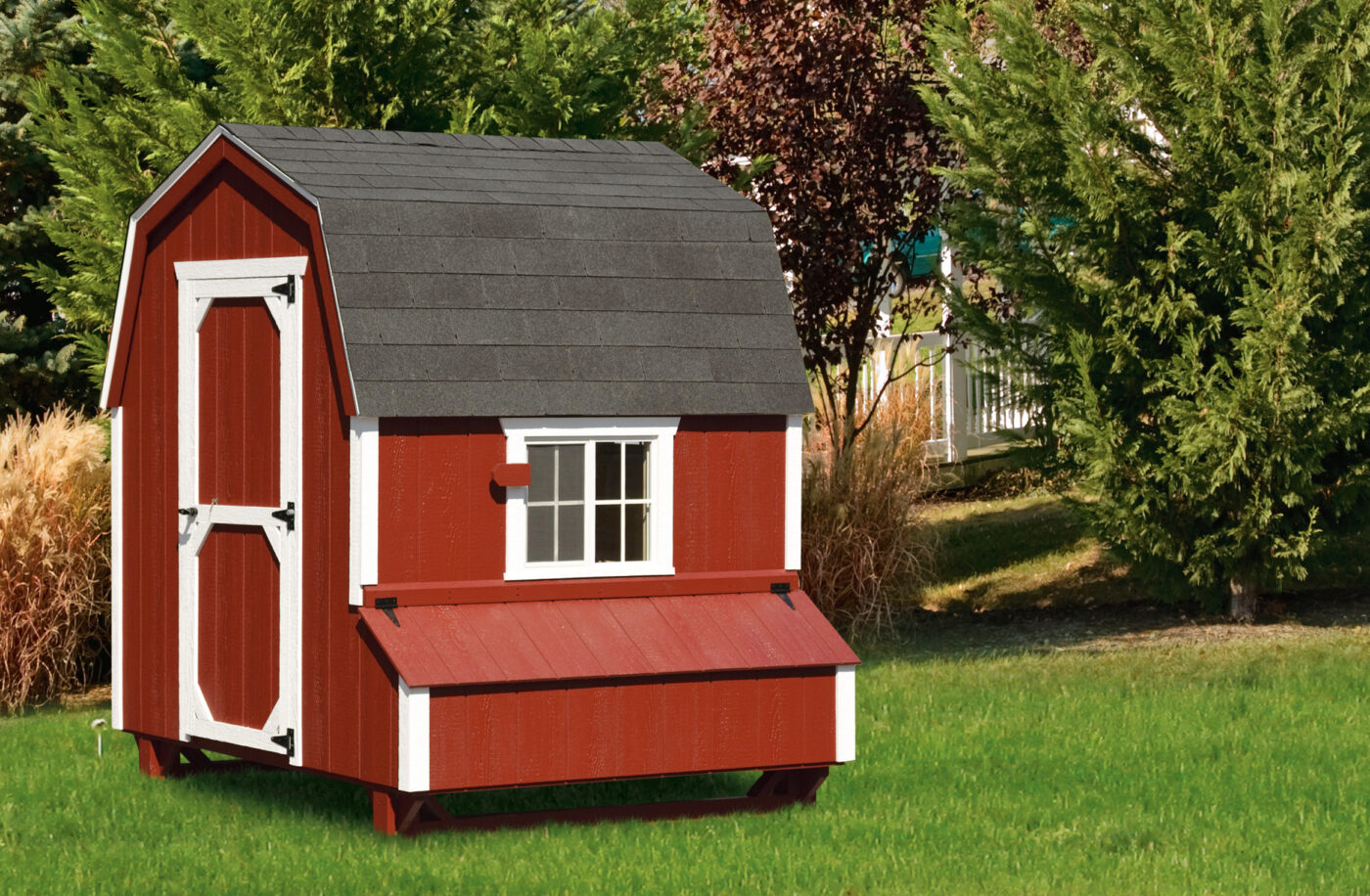 red dutch coop with white trim side window with egg collection box beneath and shingle roof