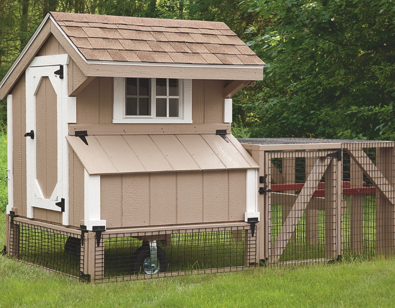 tan and white trimmed tractor chicken coop with tan shingle roof attached run handles and wheels