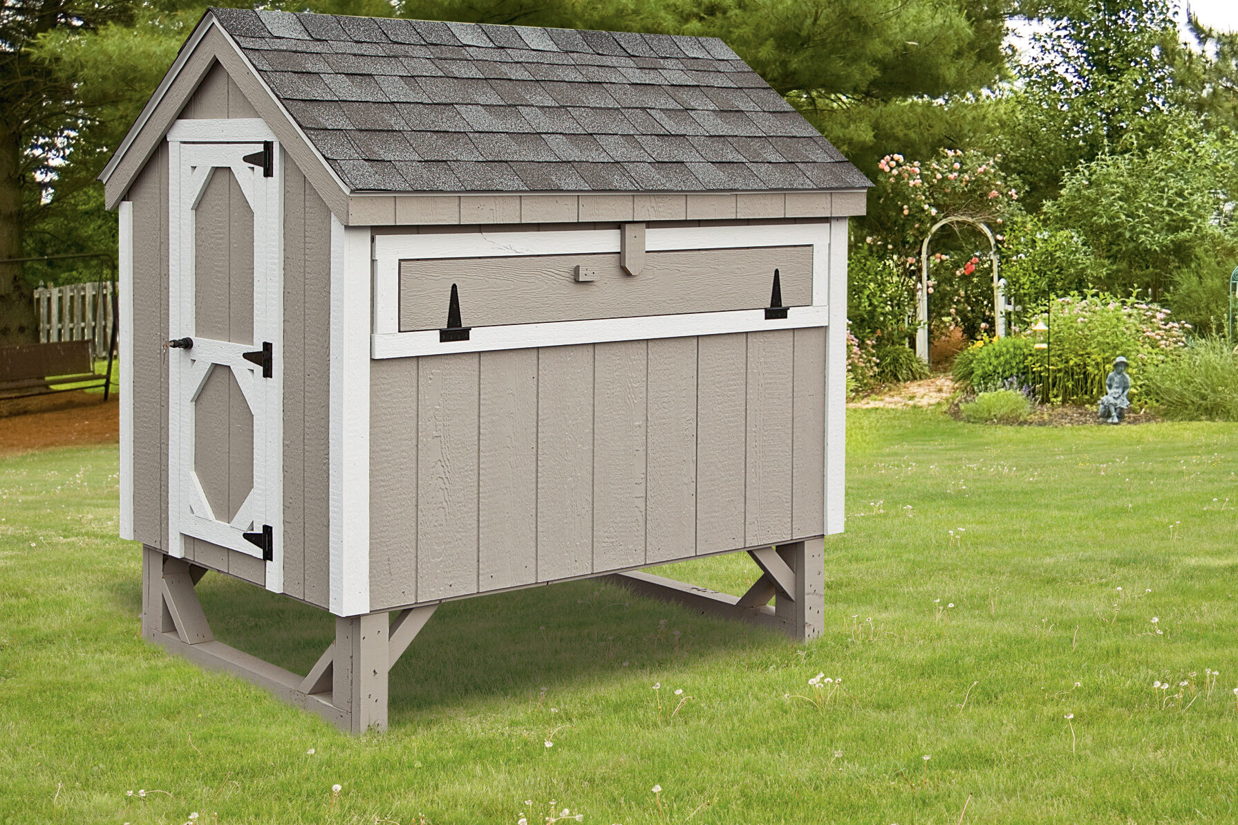 gray A frame coop with white trim and a shingle roof