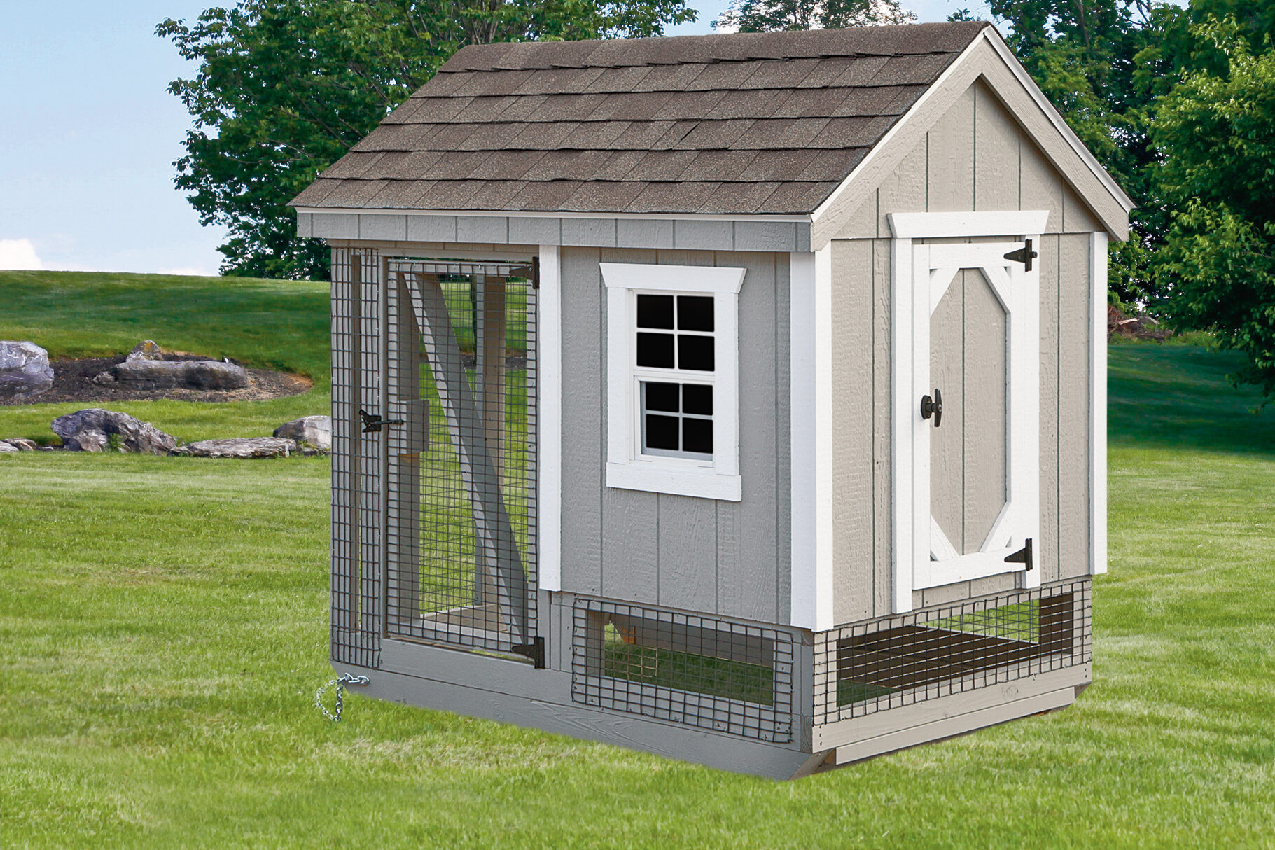 gray A frame coop with white trim shingle roof and attached run