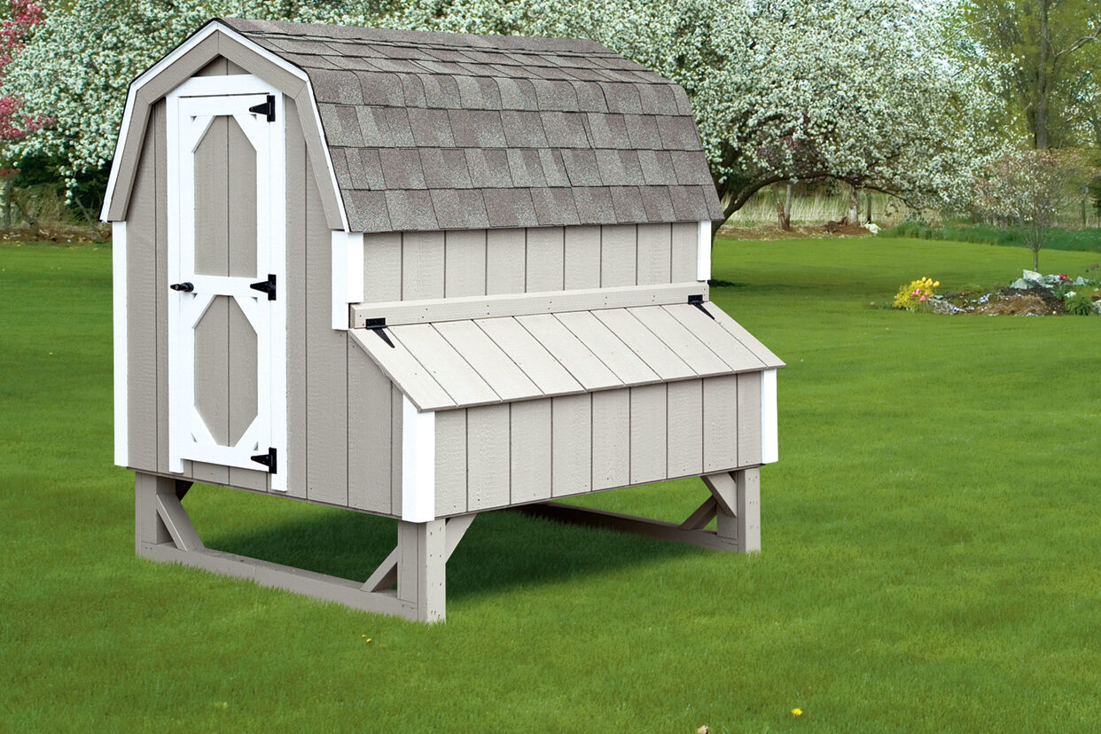 gray dutch coop with white trim and shingle roof
