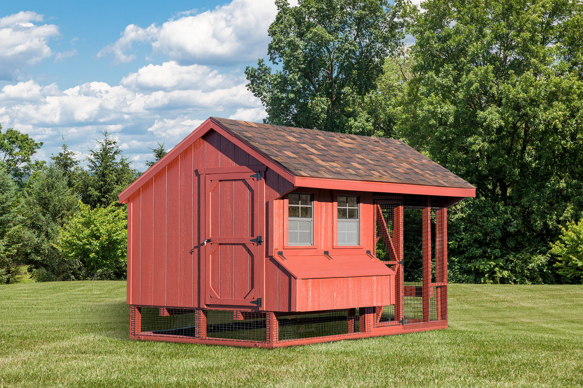 red combination coop with outdoor run side door two front windows with egg collection box underneath and a shingle roof