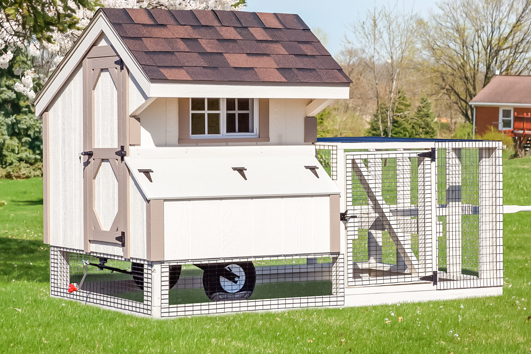 white tractor chicken coops in Kentucky with tan trim wheels and attached run