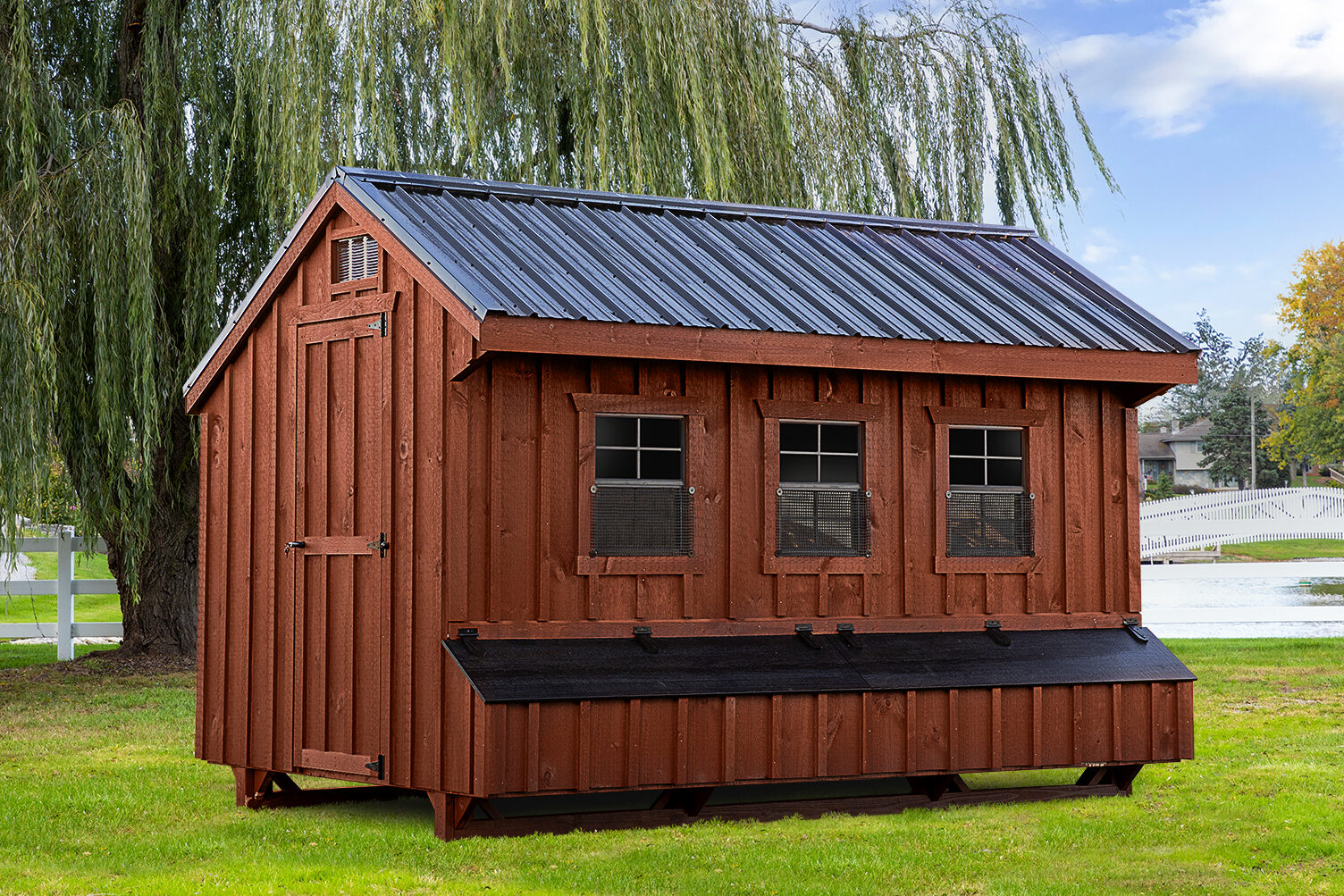 wooden chicken coops in South Carolina with black metal roof three windows and an egg collection box